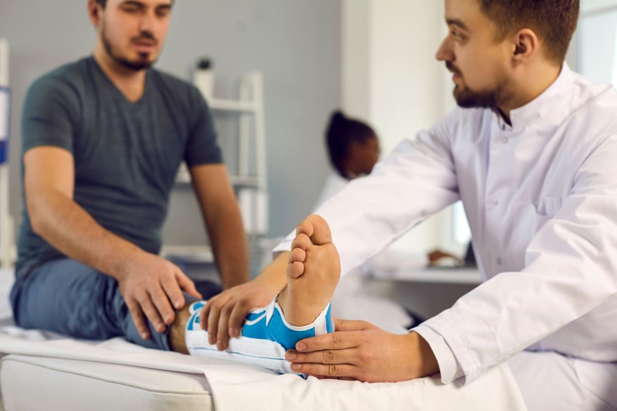 man with broken leg in hospital doc examine him